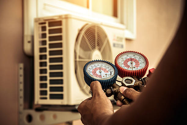 Professional Heat Pump Repair technician working in Stow, MA